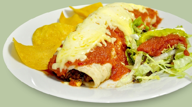 Sausage burrito with topped with tomato sauce & cheese and with salad & chips on the side